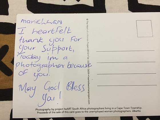 Yolanda Nkatula wrote a thank you postcard to iPhone donor, Mariellen Ward. Photo by Andrea Rees. 