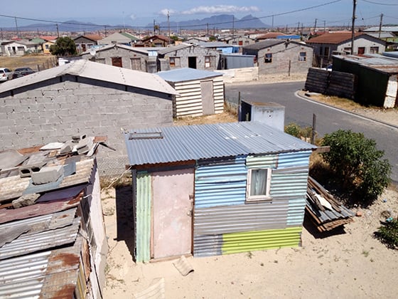 December 10, 2012 - The view from eKhaya eKasi’s rooftop in Khayelitsha, South Africa. This neighbourhood is a mixture of make shift homes made of corrugated metal and small brick homes. Photo by Andrea Rees