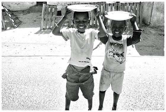     Boys in Site C in Khayelitsha, South Africa. Postcard 1.3 by Nwabisa Ndongeni