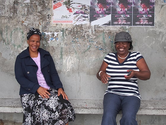 I captured this moment of Yolanda Nkatula and Esther Mahlasela at a bus stop in Khayelitsha, South Africa as I talked about capturing portraits. Photo by Andrea Rees.